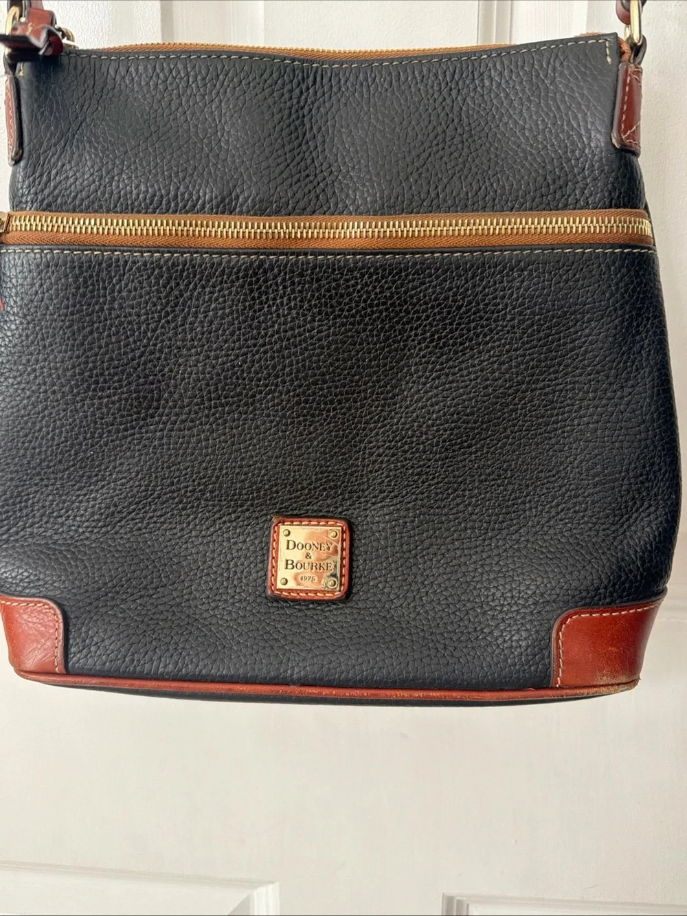 Dooney & Bourke Black Pebbled Leather Crossbody Bag with Brown Trim